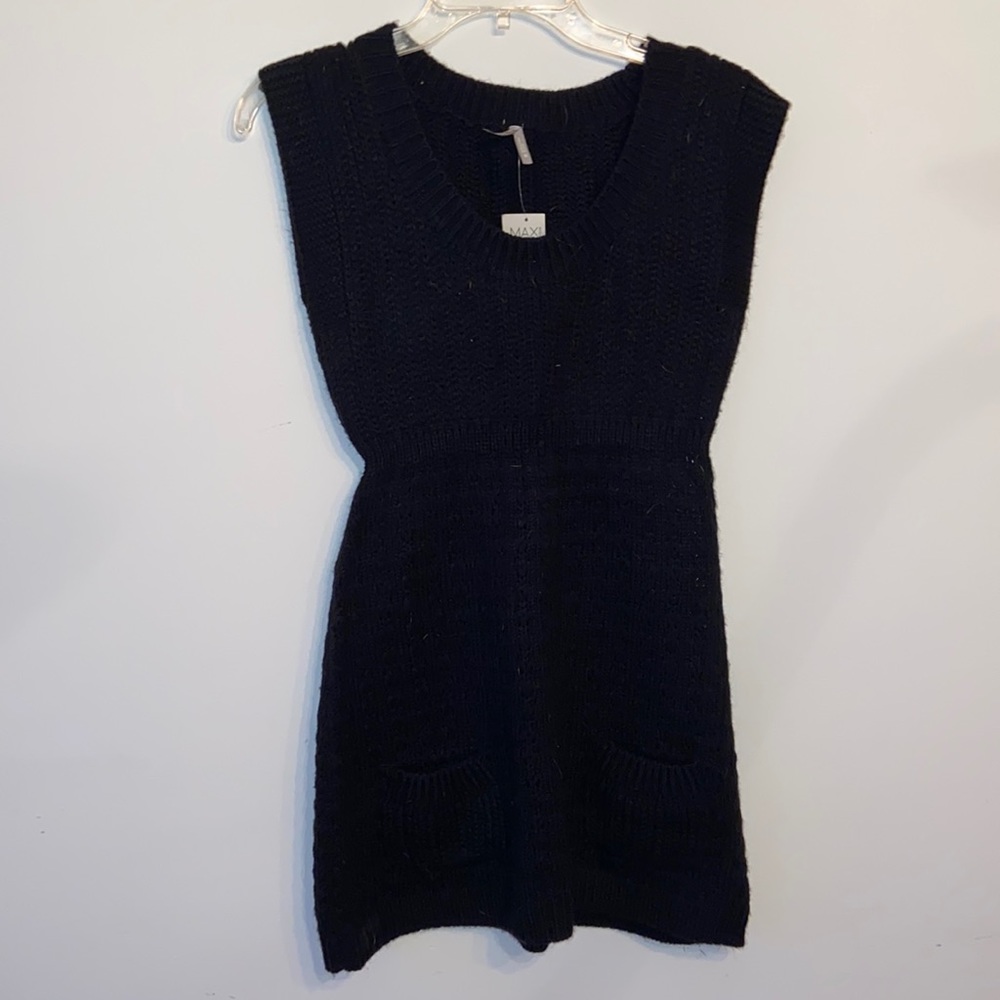 Max rave black sweater dress with two front pockets.